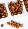 Chinese-style handcrafted beaded imitation wood, gilded silk nanmu, imitation cat's eye, silver-coated resin loose beaded accessories Application Scenario